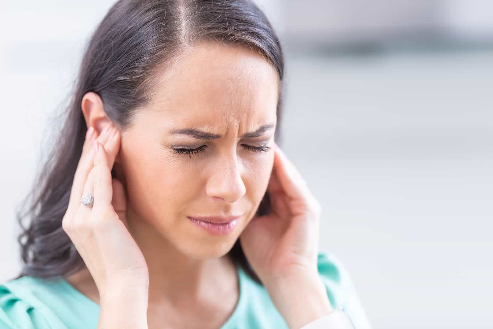 Lady suffering with tinnitus