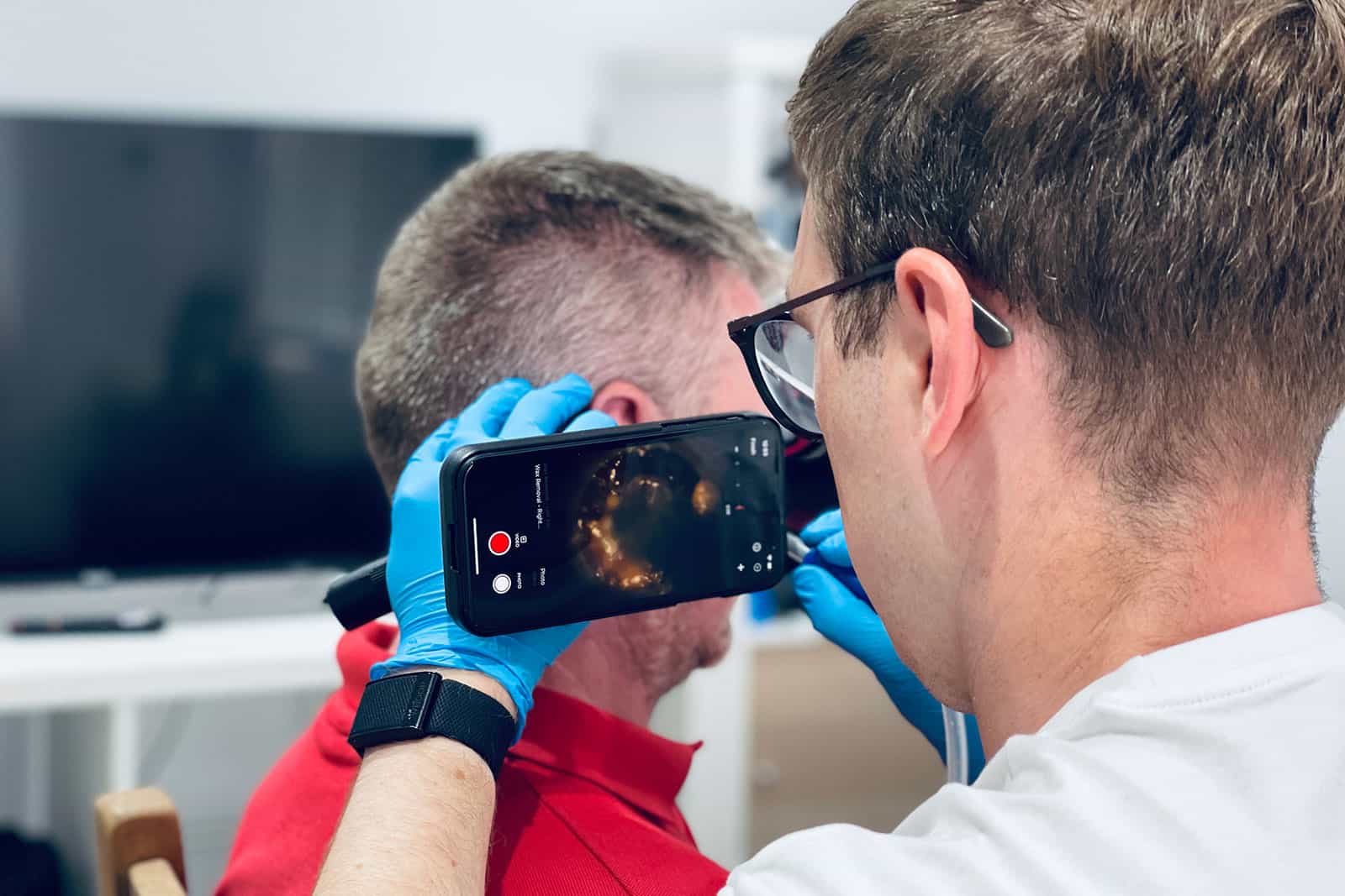 Audiologist performing microsuction