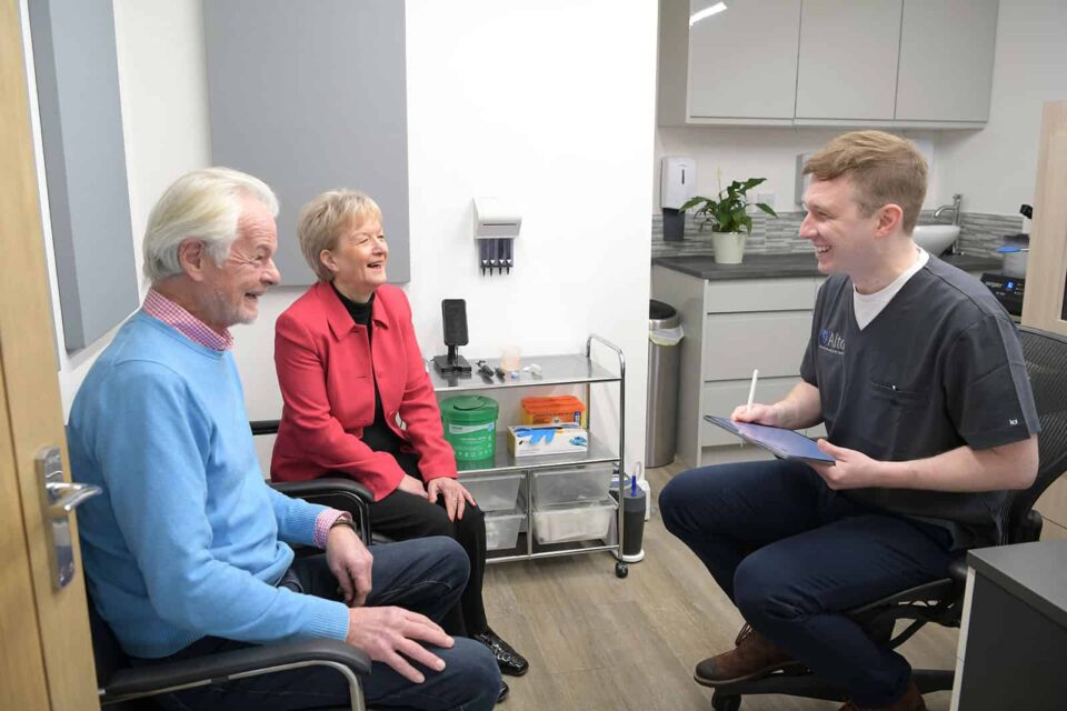 Audiologist completing a hearing consultation with a couple