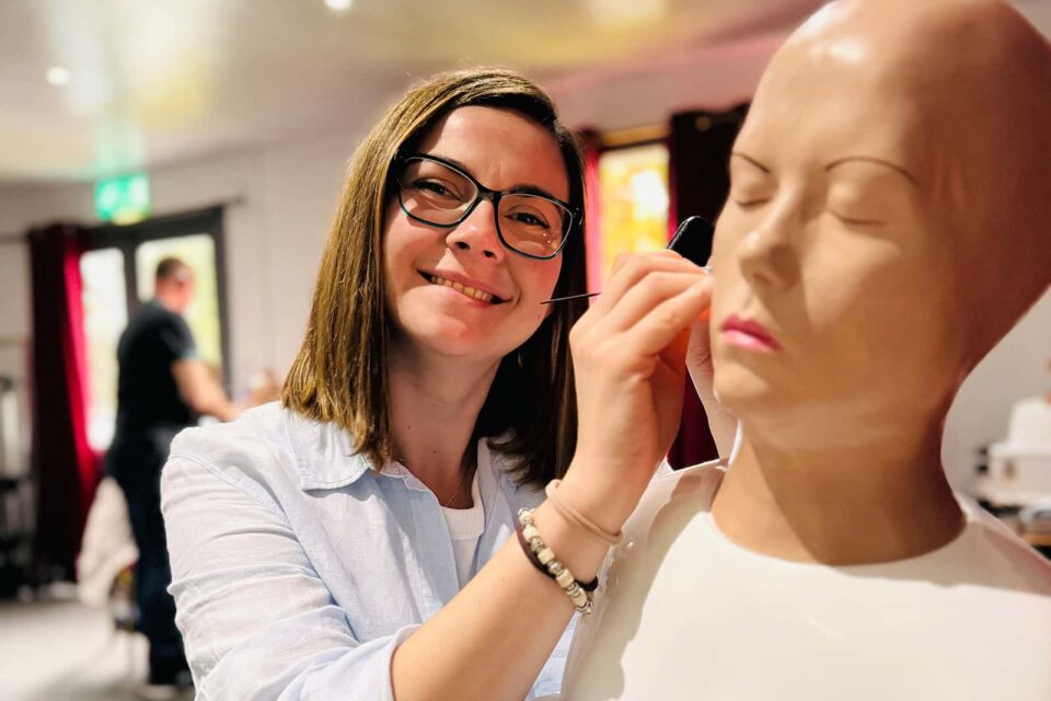 Mariia Kotovych, Ear Specialist at our Lutterworth clinic demonstrating ear wax removal