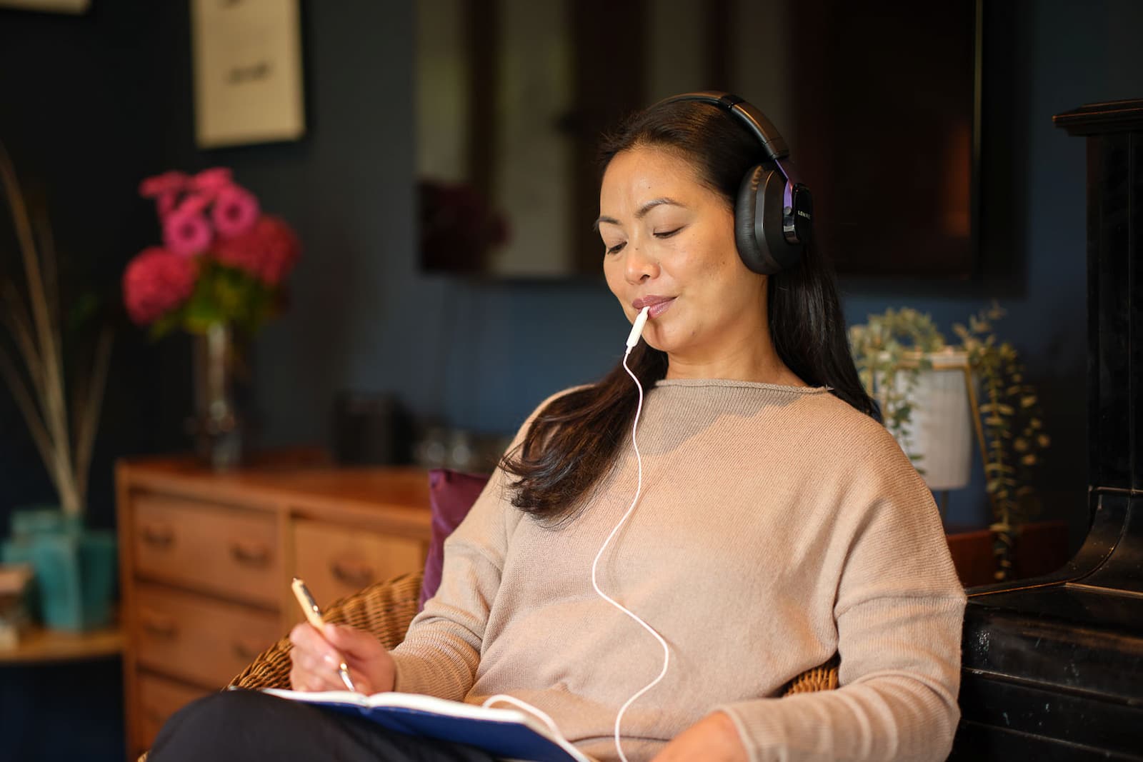 Woman using the Lenire tinnitus treatment device